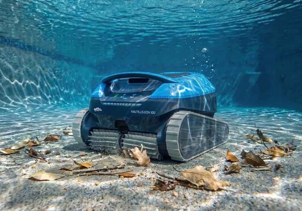 Dolphin Nautilus EON 100 cleaning leaves off a sandy pool floor with no cable