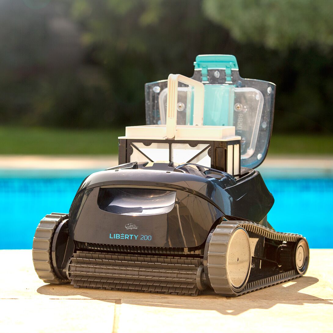 Dolphin Liberty 200 with its top-load filter basket open on the pool deck