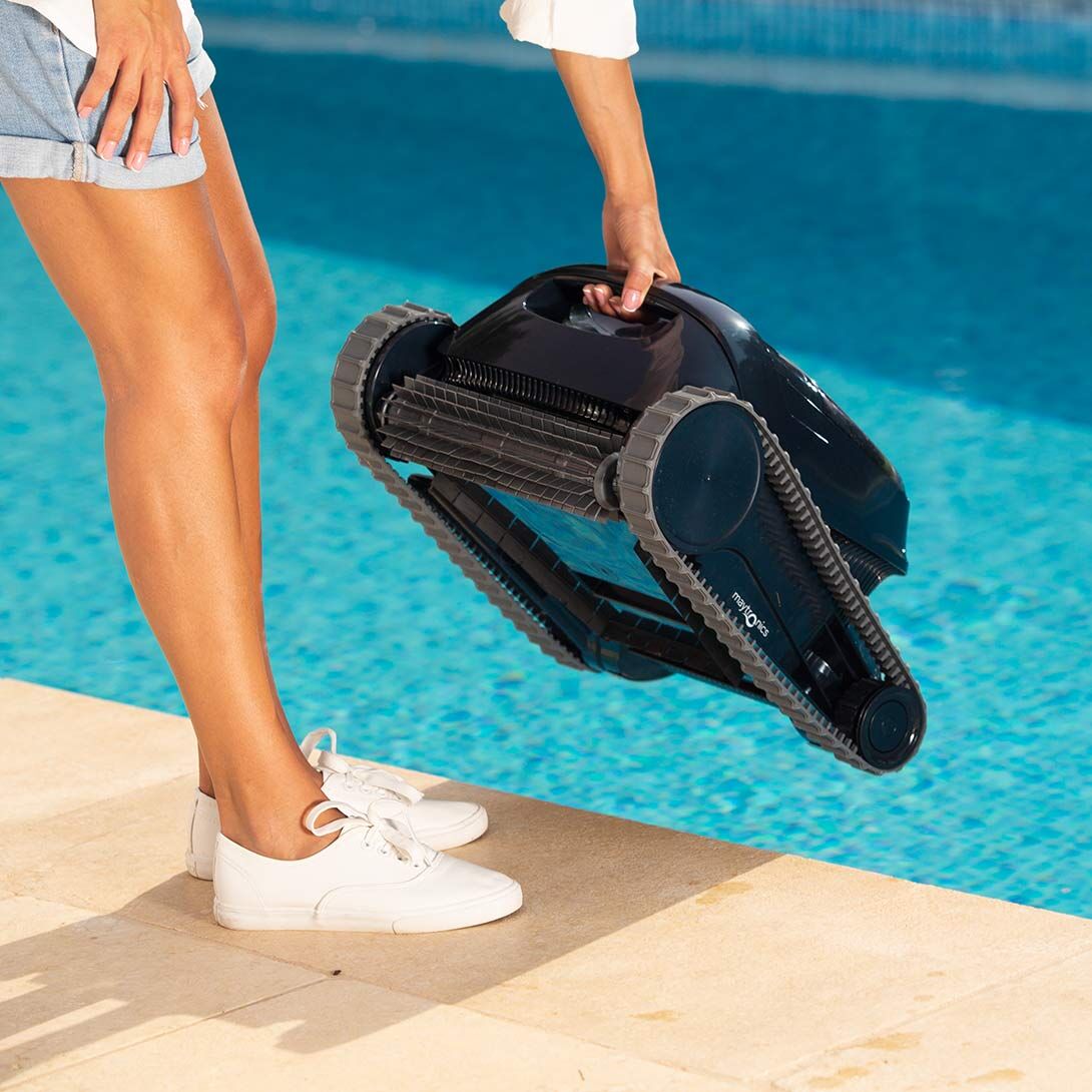 Dolphin Liberty 200 being carried to the pool by its handle, no cable attached