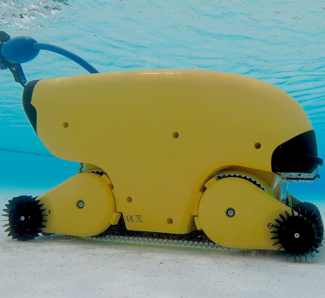 Dolphin Wave commercial robot on a sandy pool floor with its floating cable