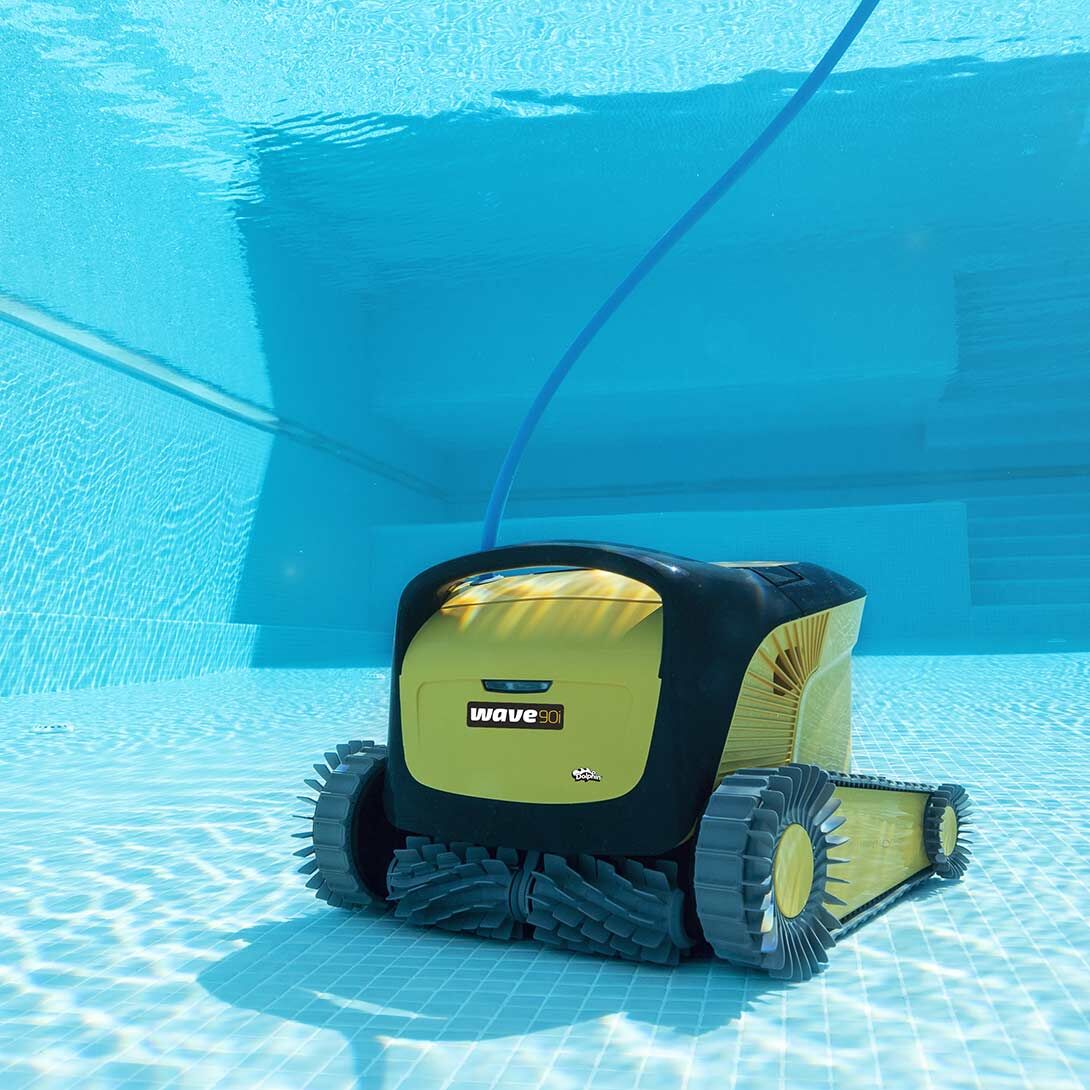 Dolphin Wave 90i cleaning the floor of a commercial pool