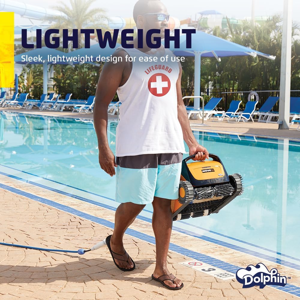 A lifeguard carrying the Dolphin Wave 90i poolside